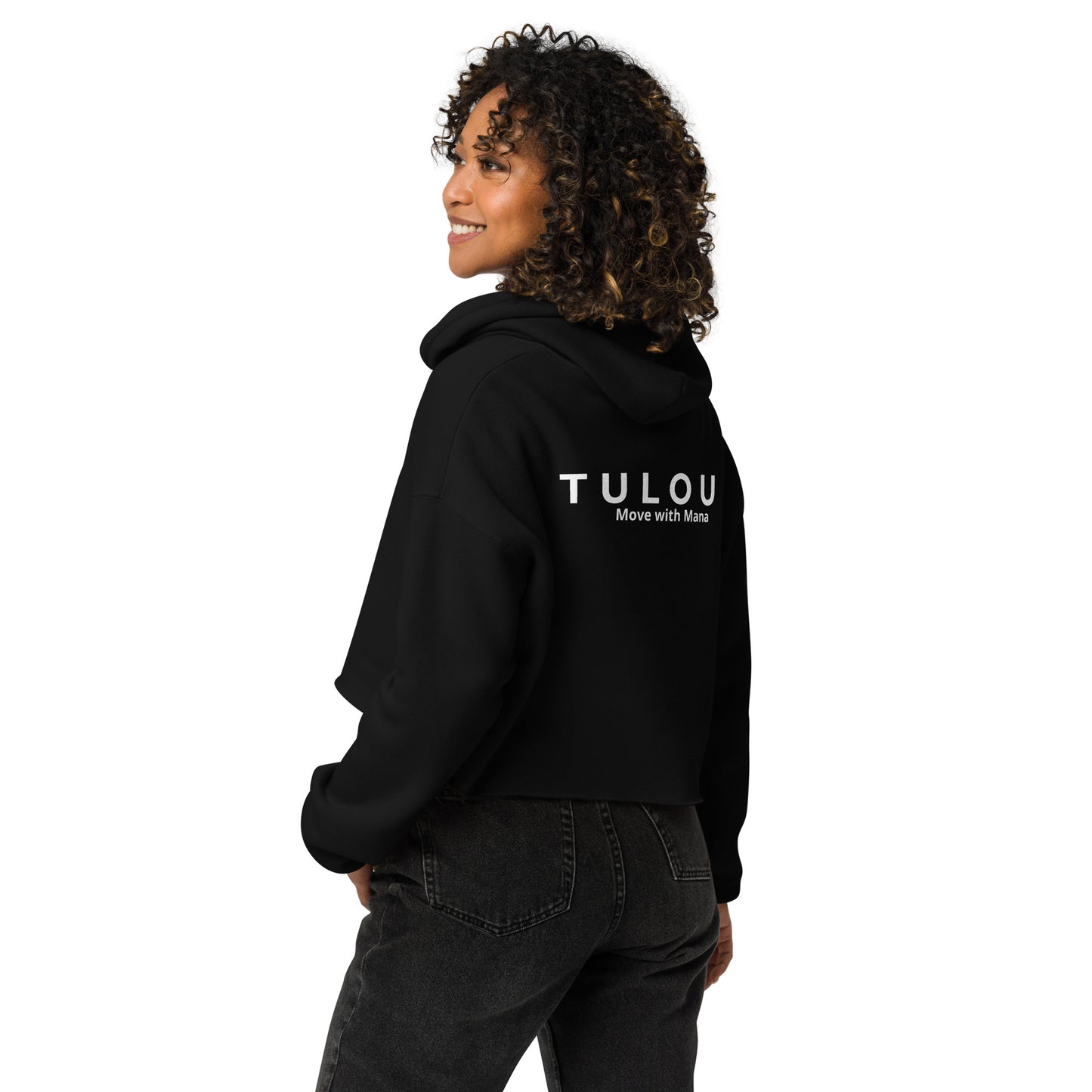 Person wearing a black hoodie with a Tulou word logo on the back, standing against a white background